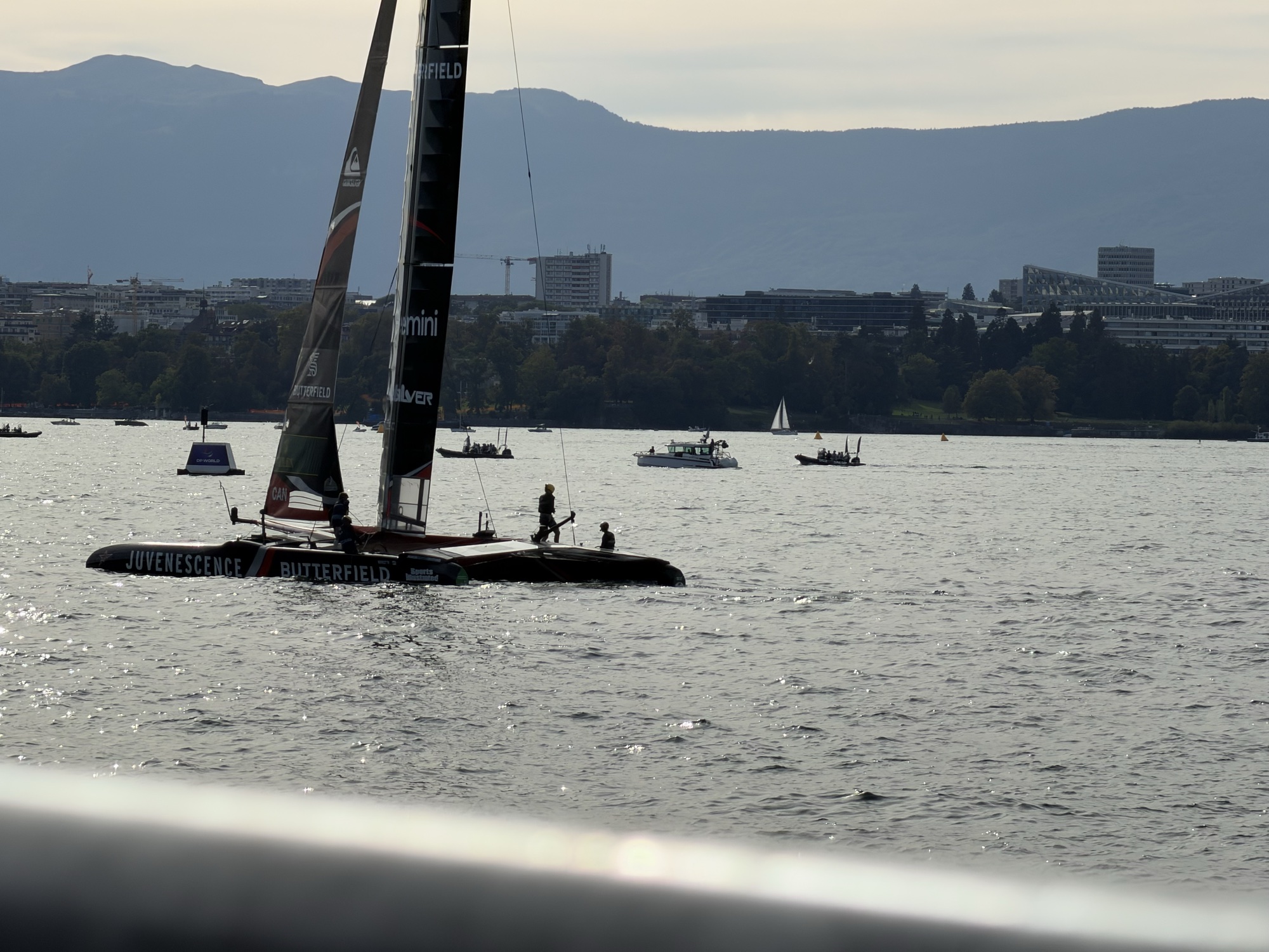 The Canadian catamaran backlit in front of Geneva